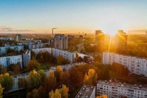 Overhead view of white buildings at golden hour.