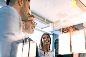 Low angle view of accounting team meeting in conference room.